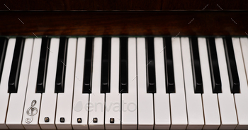 Treble clef on the piano keyboard. concept