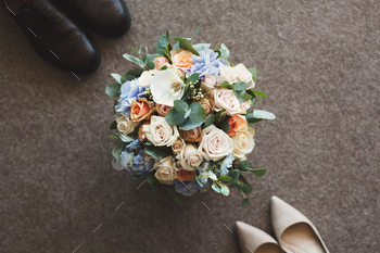 Wedding shoes, the bride's bouquet.