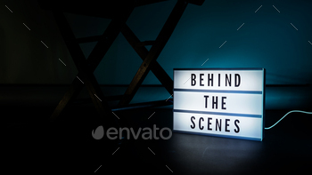 Behind the scenes light box. Text on cinema light box.