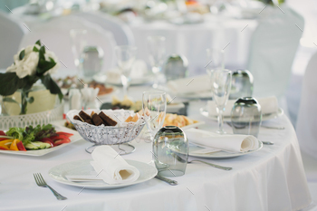 Beautifully decorated tables for guests with decorations