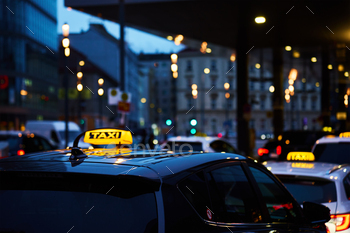 Twilight Taxi Service in City Center During Rush Hour Traffic
