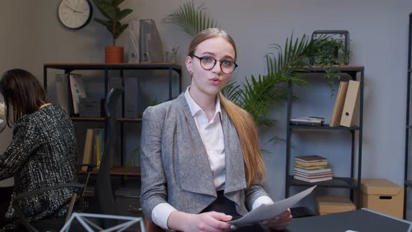 Female Business Company Manager at Office Reading Candidate Resume Unsuccessful Job Interview