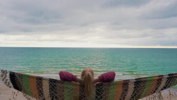 Relaxing in the Hammock by the Windy Baltic Sea and Enjoying Sea View 