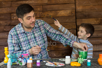 Father and son paint.