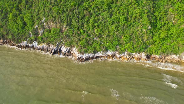 4K aerial top view, coast of mountains by the sea