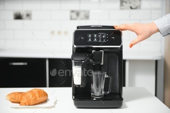 Modern coffee machine in kitchen