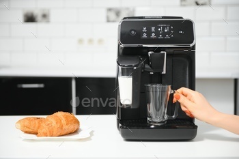Modern coffee machine in kitchen