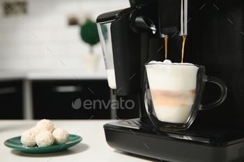 Modern coffee machine in kitchen