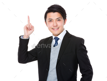 Businessman showing finger point up