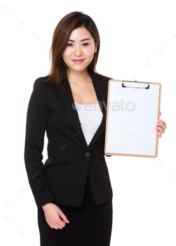 Businesswoman showing with blank page of clipboard