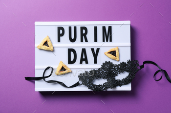 The concept of the holiday Purim, with traditional symbols.