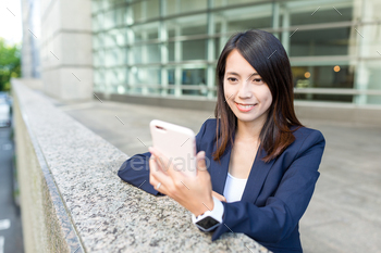 Businesswoman use of mobile phone