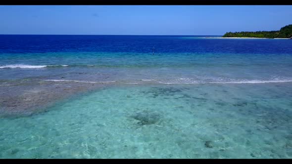 Aerial drone shot sky of tranquil bay beach journey by blue ocean with white sand background of a da