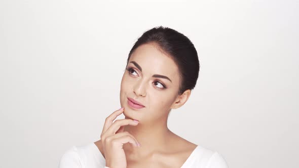 Studio portrait of young and beautiful brunette woman over