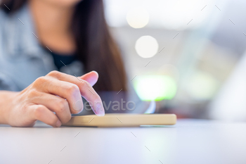 Woman use mobile phone at restaurant