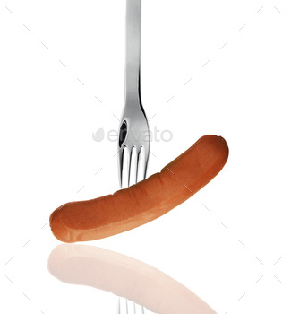 close up of sausage and fork