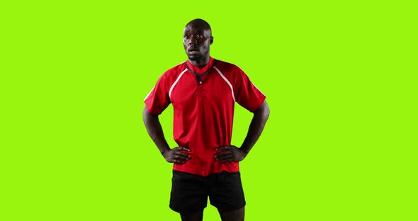 Professional Rugby Player Standing on Green Background