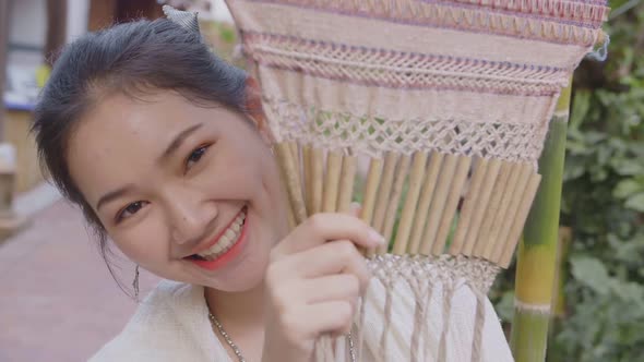 Girl In Thai Traditional Dress Smiling And Looking At Camera