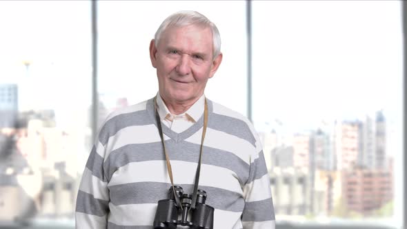 Senior Man Posing with Binoculars