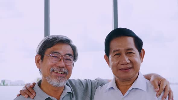 Portrait of two smiling senior men.