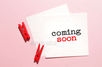 Coming soon word written on card.