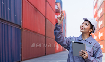 Portrait of an engineer inspecting products using a barcode scanner. Container import and logistic