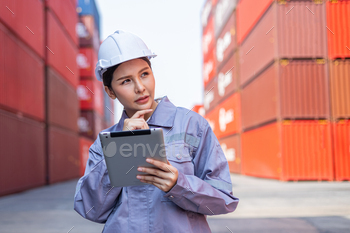 Portrait of an engineer inspecting products using a barcode scanner. Container import and logistic