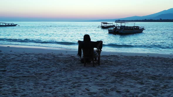 Beautiful smiling girl on vacation enjoying life on the beach on sunny blue and white sand backgroun