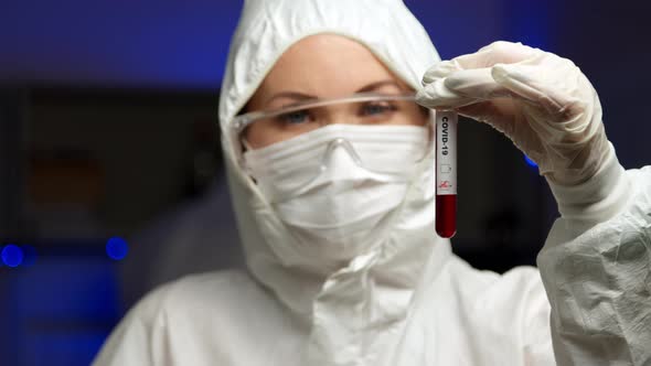 Scientist Holding COVID-19 Test Sample