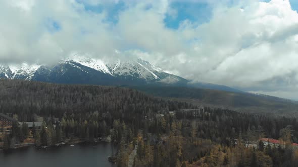 Aerial View of Strbske Pleso in the Clouds and Snowy Mountains. Slovakia