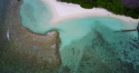 Wide aerial abstract shot of a sunshine white sandy paradise beach and blue water background in high