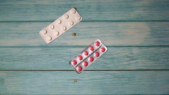 Pills on Wooden Background Stop Motion Animation, Coronavirus Pandemic Prevention Concept