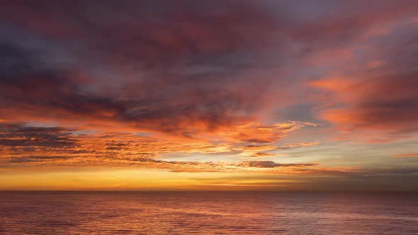 Red Fiery Sky Sunrise Over The Ocean