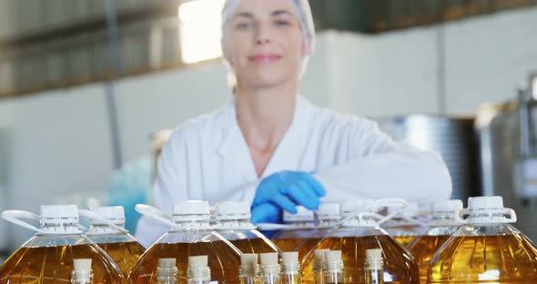 Portrait of confident female technician standing with arms crossed 4k