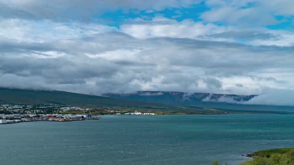Clouds Move Over Icelandic Town Akureyri and Fjord