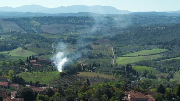 Timelapse of Smoke Rising Above Italian Countryside