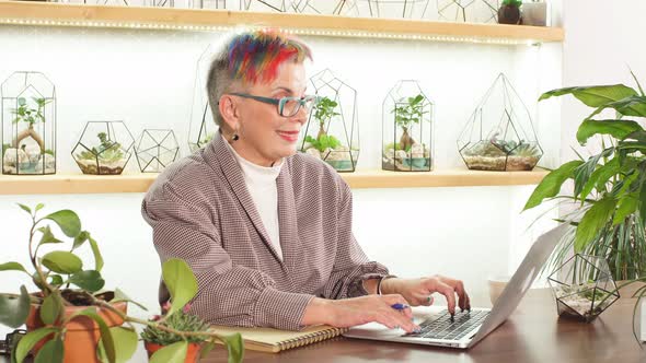 Modern Caucasian Woman 50-60 Years Old Sit Working with Laptop