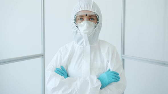 Portrait of Female Doctor in Protective Medical Suit Standing in Covid-19 Isolation Unit