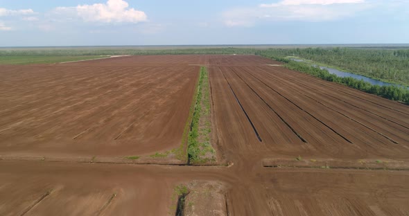 Sod Peat Production Field Peat Harvesting in Drained Bog Aerial View