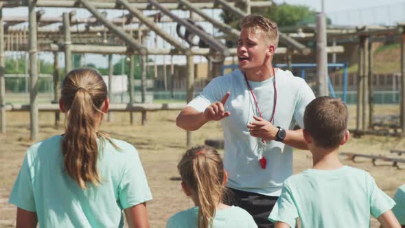 Group of Caucasian boys and girls at boot camp together