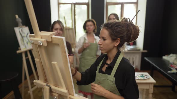 Female Students at Art Workout Leading By Mentor Listen for Instructions