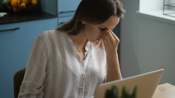 Tired Sleepy and Sad Woman in Front of Laptop