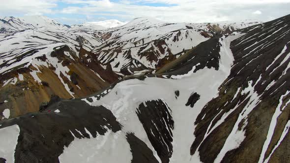 Flying over Blahnjukur (Blue Peak) volcano in Landmannalaugar region, Iceland