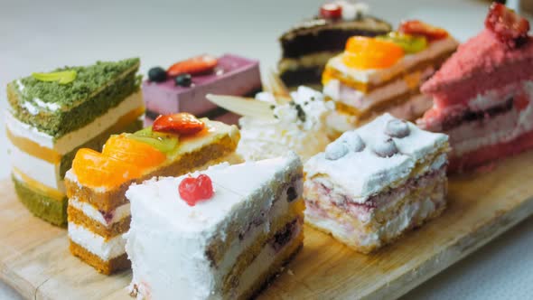 Pieces of Different Cakes on a Retrostyle Baking Tray