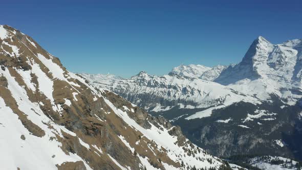 Aerial view of mountain ridge covered in snow