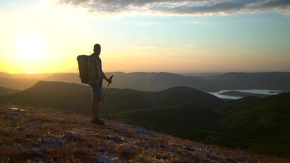 Silhouette of Climber Mountain Hike Travel Enjoy Gold Sunset Stand in Sun Rays Spbd