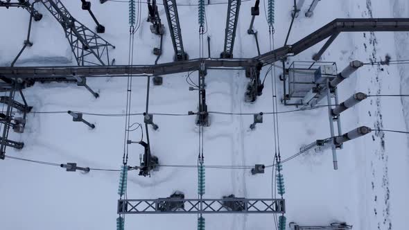 Aerial view of a high voltage electrical substation in winter season.