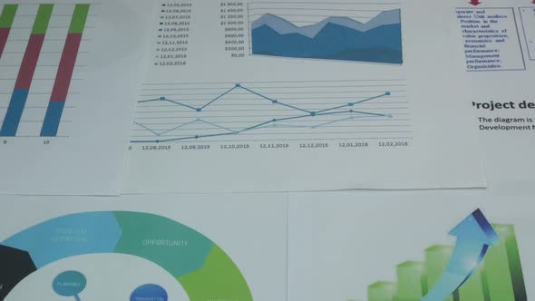 Business Diagrams On A Table In A Modern Office