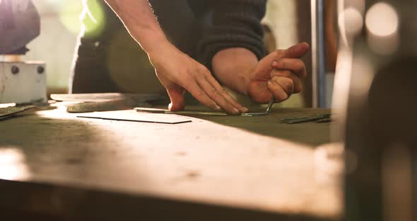 Bladesmith carving blade on steel