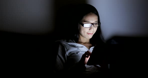 Woman Using Digital Tablet Computer at Home